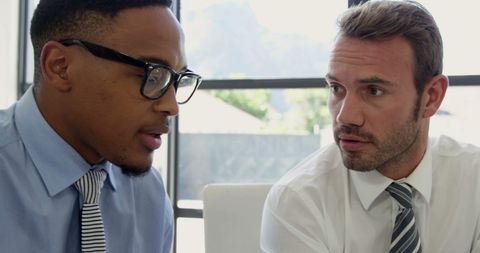 Diverse Businessmen Collaborating in Office Setting