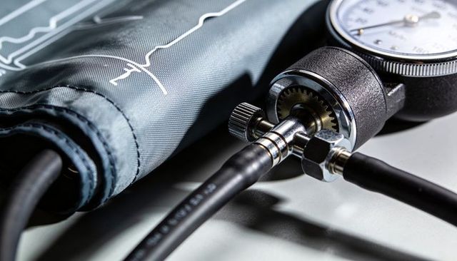 Macro view aneroid sphygmomanometer cuff with dial gauge and metal fittings