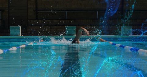 Athletic Male Swimming Freestyle During Outdoor Training