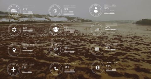 Aerial view of digital icons over agricultural landscape