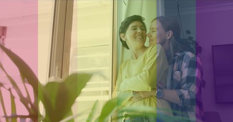 Happy Lesbian Couple Embracing at Home with Pride Colors Overlay
