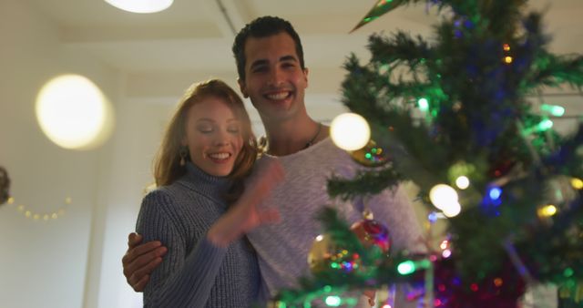 Happy Couple Decorating Christmas Tree Together Indoors - Download Free Stock Images Pikwizard.com