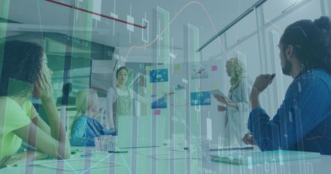 Diverse team analyzing financial projections in modern office