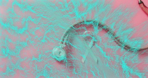 Stethoscope and pink ribbon featuring turquoise texture overlay for health campaign