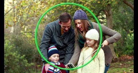 Family Enjoying Time Together Outdoors in Autumn