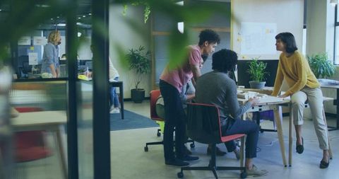 Team Discussing Architectural Project in Modern Office Space