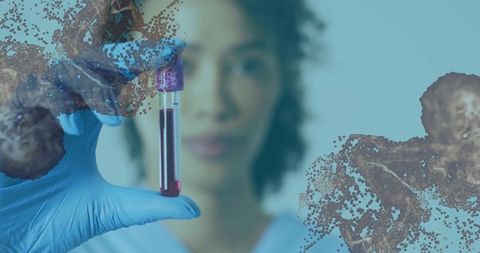 Clinical lab technician holding blood sample tube with cellular overlays for diagnostics