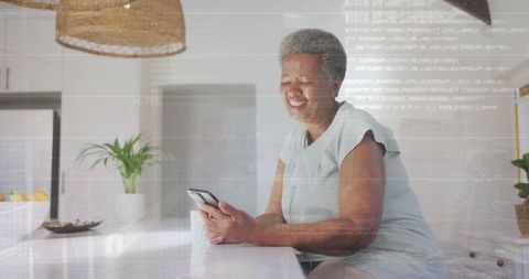 Senior Woman Engaged with Smartphone and Digital Data Overlay