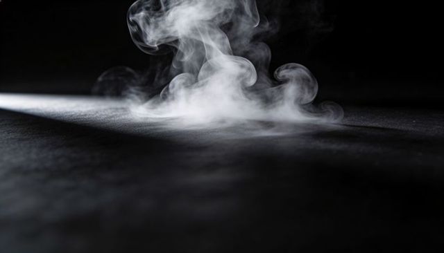 White Smoke Curling Across Dark Textured Surface under Narrow Side Beam, Dramatic Vapor