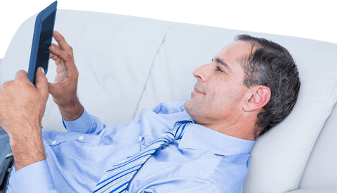 transparent relaxed businessman using tablet on sofa - Download Free Stock Videos Pikwizard.com