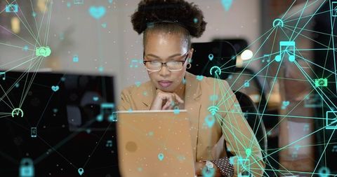 Professional Woman Analyzing Digital Data in Modern Workplace