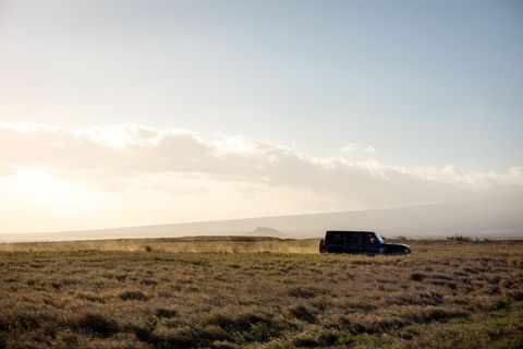 Offroad Adventure Vehicle on Rural Country Road at Sunset
