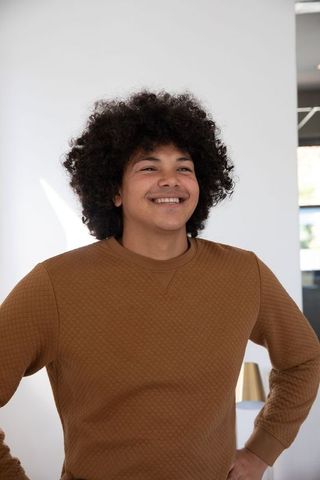 Confident Young Man in Modern Office with Stylish Interior