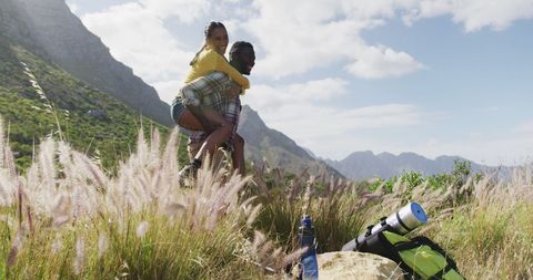 Couple Enjoys Mountain Trekking Adventure with Piggyback Ride