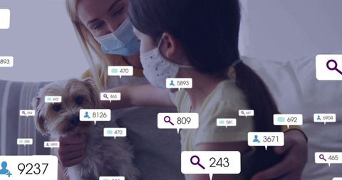 Mother and Daughter with Dog Browsing Online Data in Masks