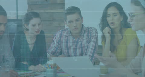 Diverse Team Analyzing Financial Data in Collaborative Office