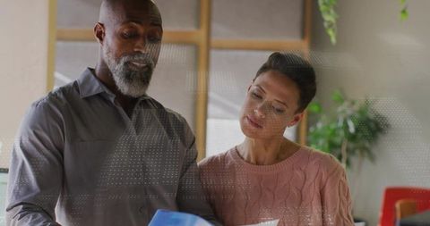 Professional team reviewing documents in modern office