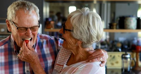 Senior Couple Sharing Joyful Moment in Cozy Kitchen - Download Free Stock Images Pikwizard.com