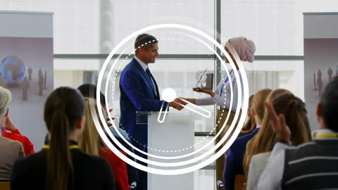 Diverse Colleagues Shaking Hands at Office Presentation