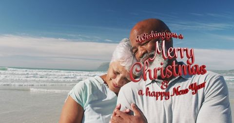 Romantic Senior Couple Embracing at Beach During Holiday Season