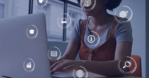 African American Businesswoman Using Laptop with Digital Data Icons Overlay - Download Free Stock Images Pikwizard.com
