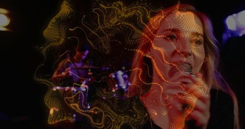 Singer performing with microphone and abstract golden light projection double exposure