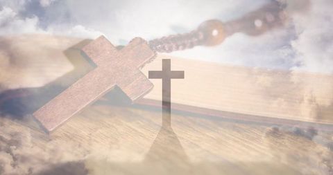 Wooden cross and bible double exposure evoking prayerful faith, hope, spiritual reflection