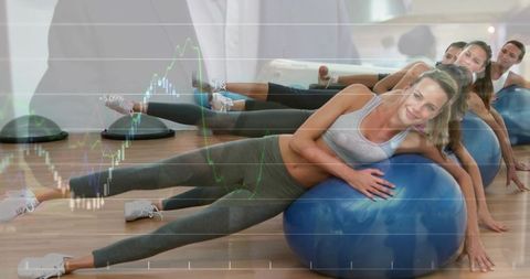 Women balancing on stability balls holding side plank in group fitness with chart overlay