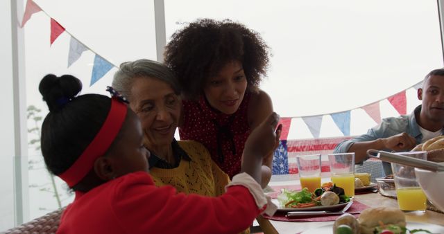 Multigenerational family celebrating with festive breakfast - Download Free Stock Images Pikwizard.com