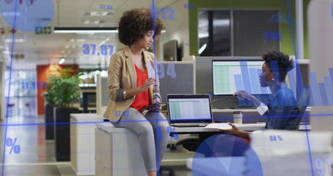 Colleagues Analyzing Data with Statistical Graphics in Modern Office