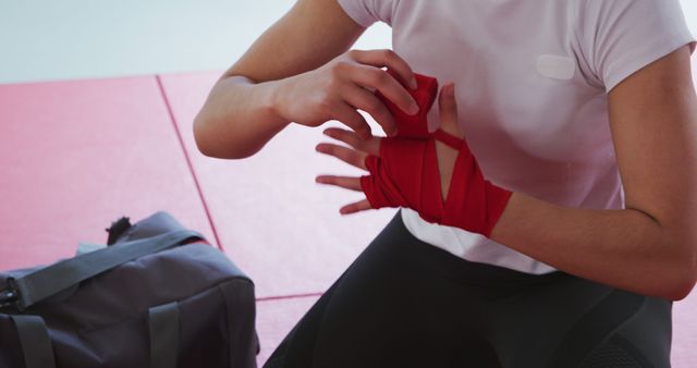 Female Athlete Wrapping Hands with Boxing Wraps Before Training - Download Free Stock Images Pikwizard.com