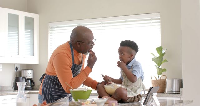 Grandfather and Grandson Enjoying Time Together in Kitchen - Download Free Stock Images Pikwizard.com