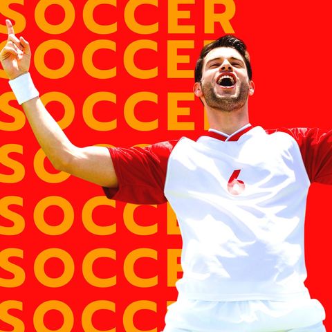 Joyful male soccer player celebrating victory