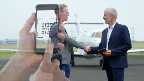 Businessmen Handshake with Mobile Interface Overlay