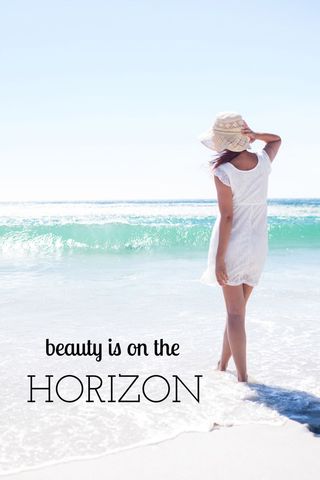 Woman in white dress enjoys tranquil ocean views