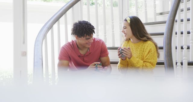 Smiling Friends On Staircase Holding Cups And Enjoying Coffee Together - Download Free Stock Images Pikwizard.com