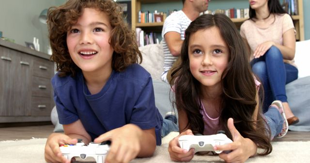 Happy Children Playing Video Games at Home with Family - Download Free Stock Images Pikwizard.com