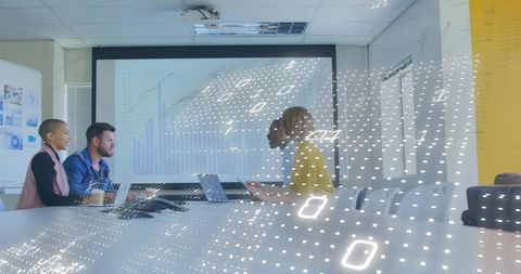 Presenting augmented analytics: team collaborating and visualizing data in conference room