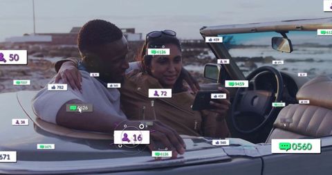 Couple enjoying coastal view from convertible with social media interface