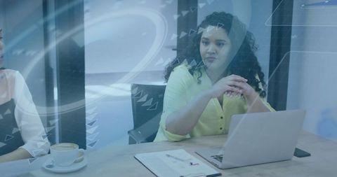 Businesswoman Leading Data Meeting with Laptop and Coffee