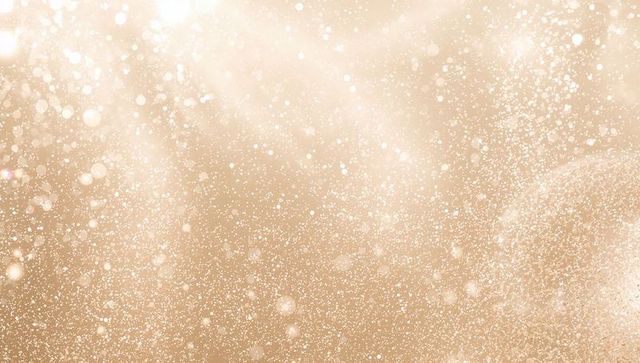 Shimmering Golden Glitter Bokeh Field with Soft Light Sparkle and Warm Glow Texture