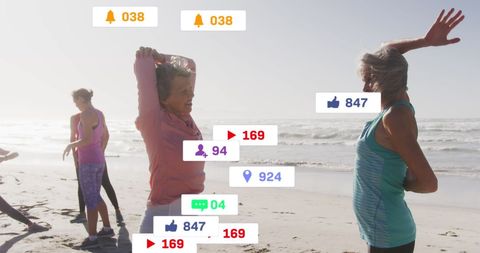 Senior Women Exercising on Beach with Social Media Notifications