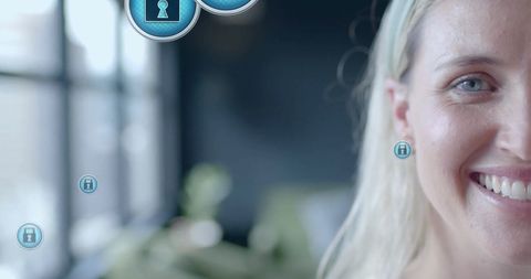 Businesswoman engaging with digital security interface in office