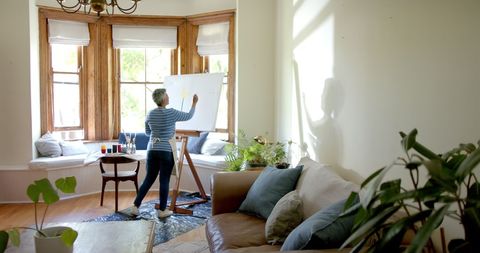 Senior Woman Painting on Large Canvas in Home Living Room - Download Free Stock Images Pikwizard.com