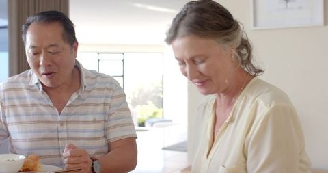 Diverse Senior Couple Enjoying Intimate Breakfast at Home