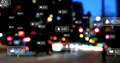 Social Media Notifications Floating Over Urban Night Traffic with Bokeh Lights and Icons