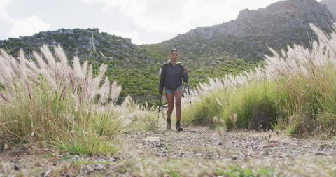 African American Woman Hiking with Trekking Poles in Scenic Mountains - Download Free Stock Images Pikwizard.com