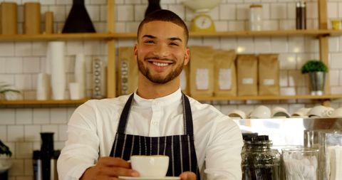 Smiling Barista Offering Freshly Brewed Coffee - Download Free Stock Images Pikwizard.com