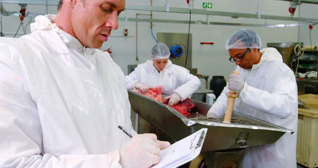 Male Butcher Taking Notes at Meat Processing Facility - Download Free Stock Images Pikwizard.com