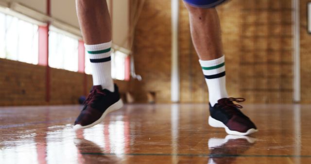 Closeup of Basketball Player Dribbling on Indoor Court - Download Free Stock Images Pikwizard.com